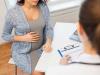 What can cause curdled discharge during pregnancy?